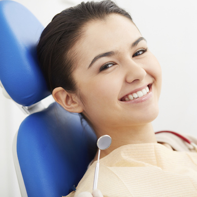 Dentistry New York City - Headshot of a girl in the dentist chair having a comprehensive dental exam.