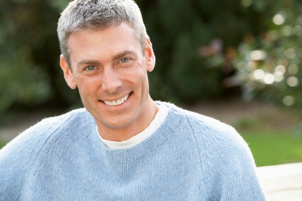 A man who has experienced oral surgery in Midtown New York